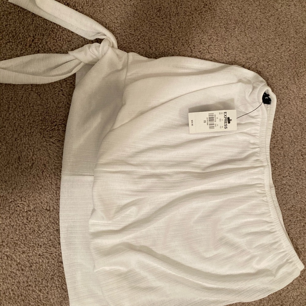 One off the shoulder white. One tank pink
